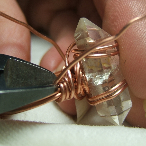 How to wire wrap a quartz crystal, a long stone or a long cabochon into a simple ring - free tutorial bfrom Magpie Gemstones.