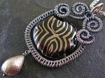 Nancy Wickman's free tutorial on how to make a wire pendant.