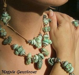 This necklace is made with Greek Leather and large hole turquoise. The closure is a knotted loop over a rondelle, by Szarka