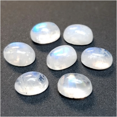 5 Rainbow Moonstone Oval Cabochon Loose Cut Gemstone (N) Approximate size 4.85 to 5.20mm x 7.06 to 7.42mm CLOSEOUT